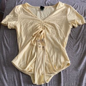 yellow tshirt bodysuit. size extra small.